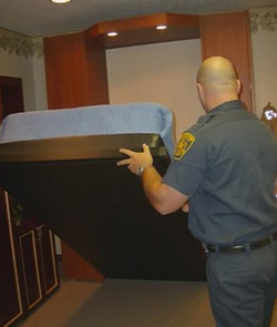 a firefighter can easily and quickly convert the wall bed from a fold-up position to a comfortable full-size bed ready for sleep and rest